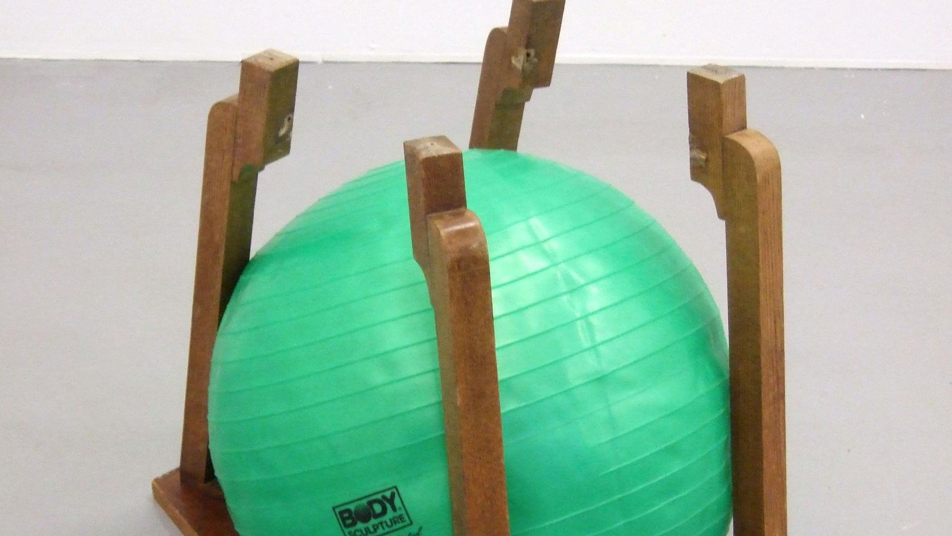 Bettina Buck, In Shape In Control, 2009, wooden table, half inflated rubber ball, 55 x 65 x 50 cm, Courtesy the artist, Rokeby London and Galerie Opdahl, Berlin